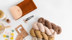 An image of a handful of yarn supplies and bits & bobs